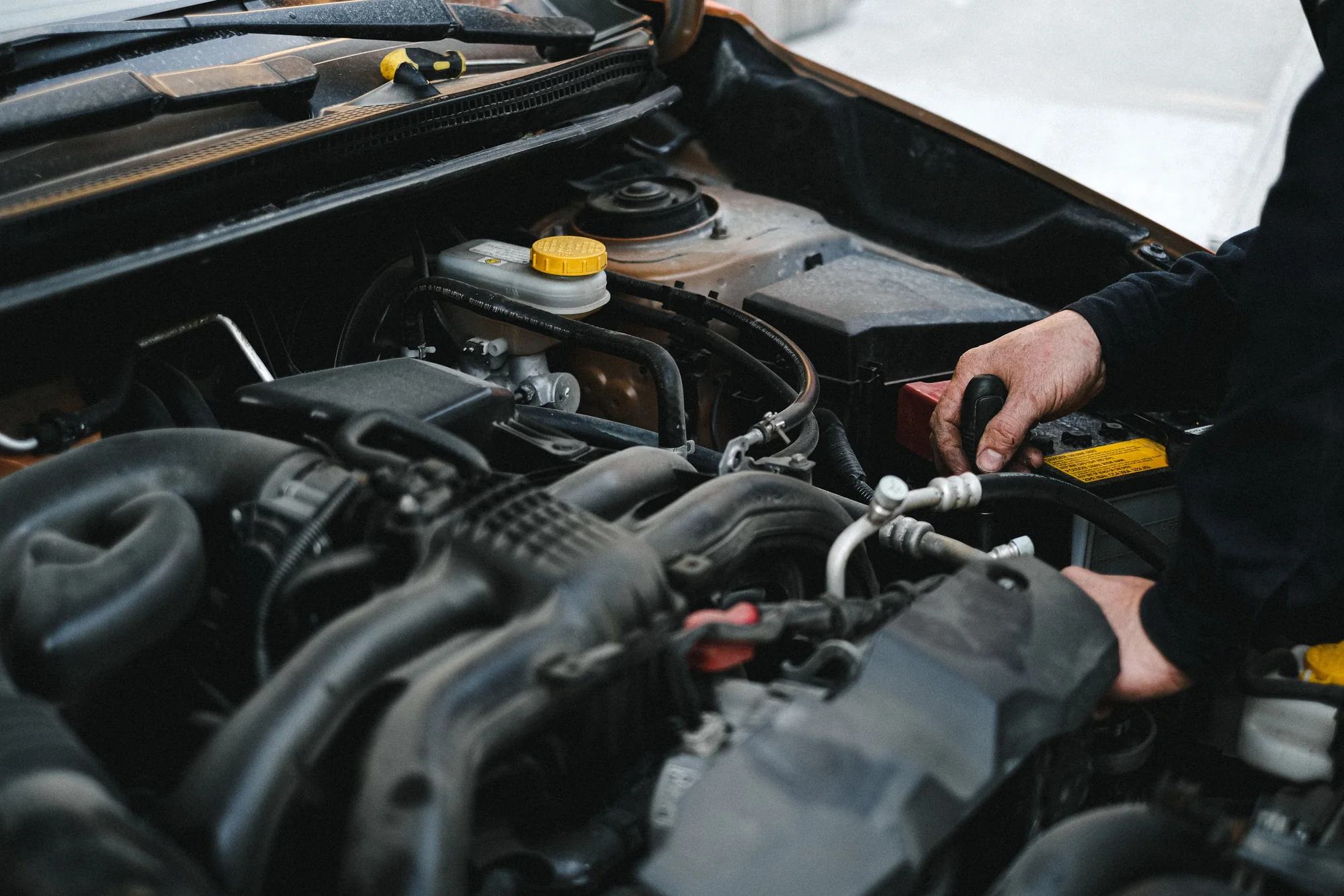 Stock photograph of work in the engine bay